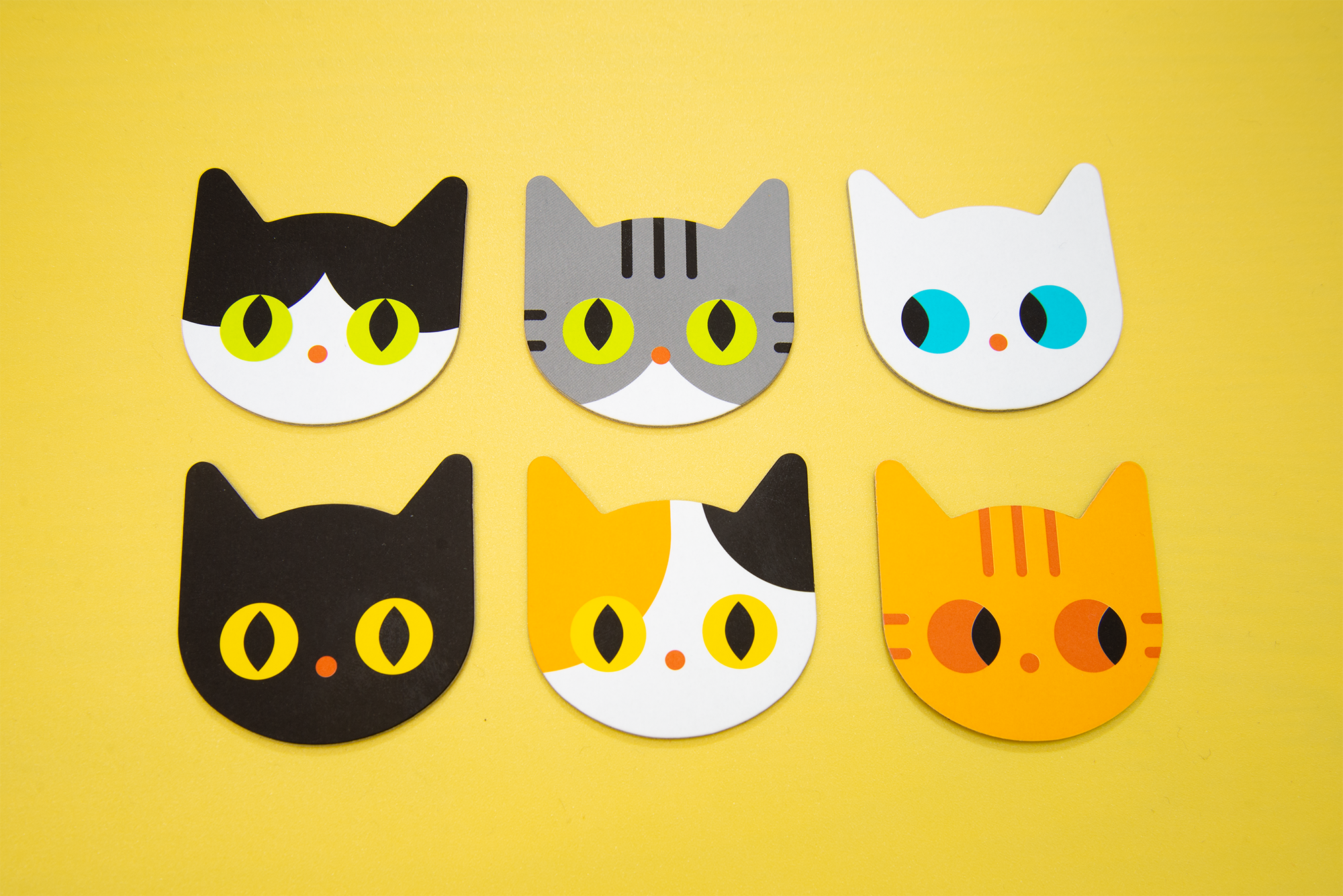 Six cat designs on Meow Tiles pieces, with different eye colors.