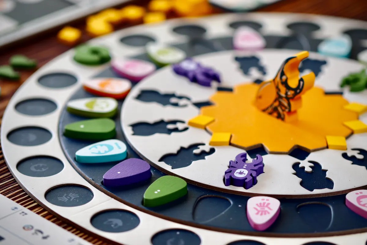 STAG prototype table photo showing player boards, card rows, and beetle components during play.