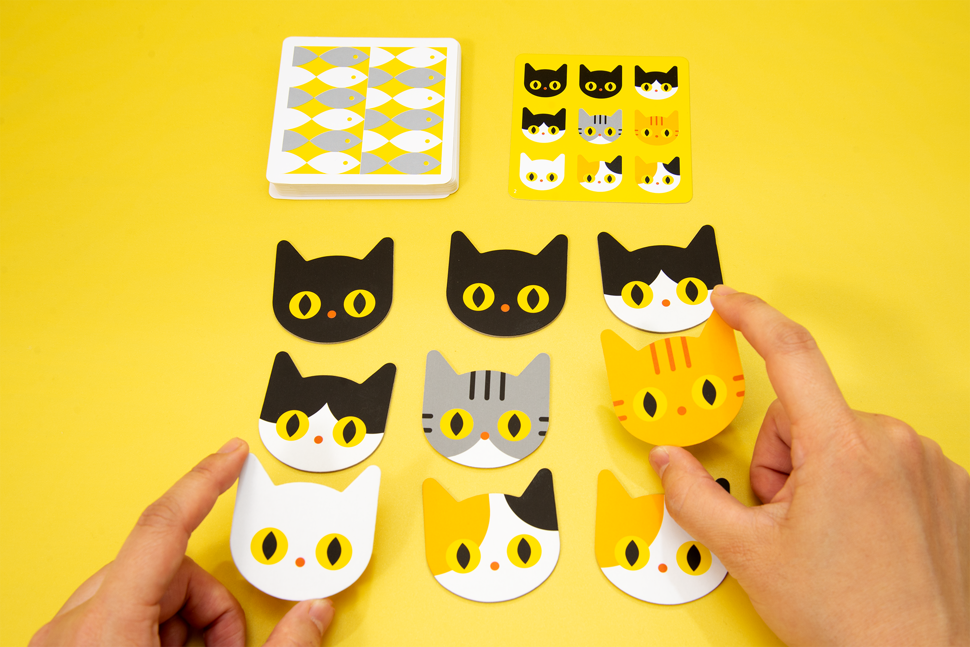 Meow Tiles cat pieces and a target pattern card from Oink Games.