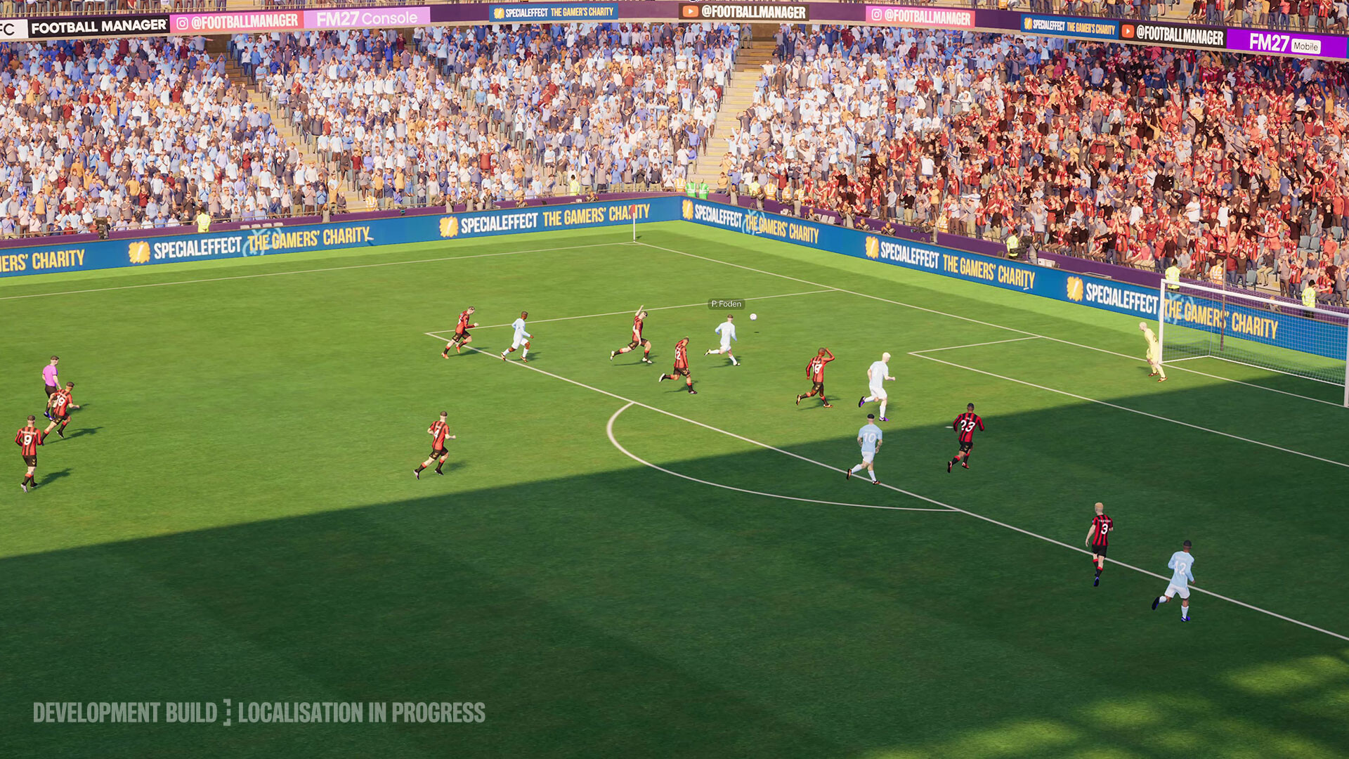 Football Manager 27 match action near goal, with a development-build and localisation warning.