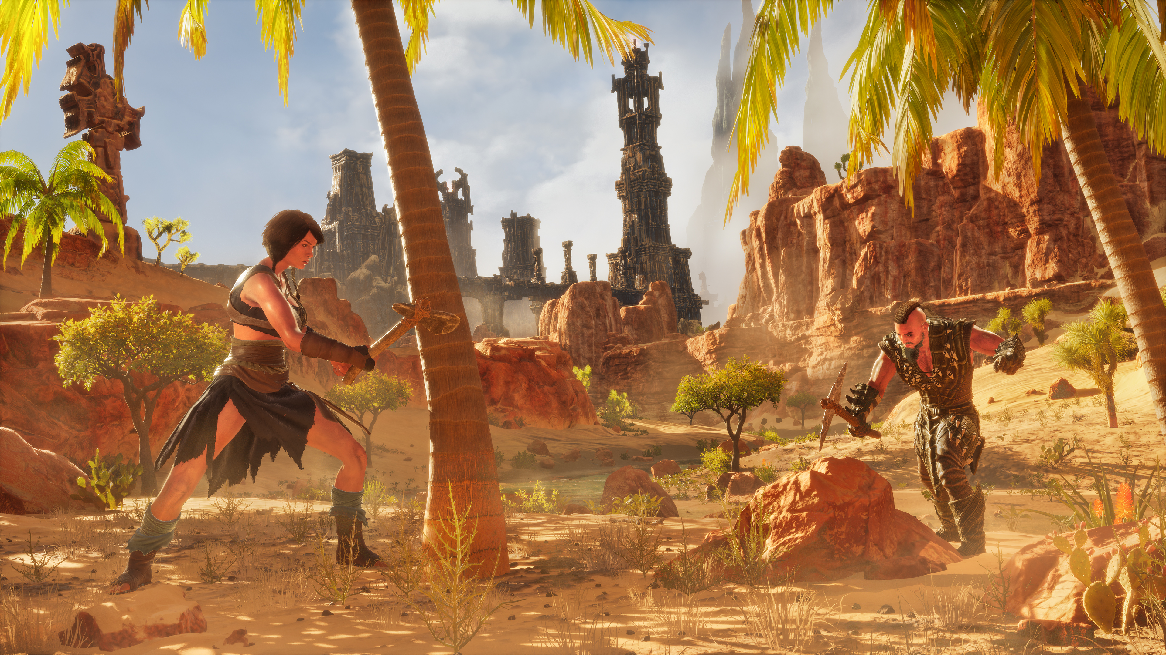 Two characters use tools beside a palm tree and desert rocks, with ruined towers behind them.