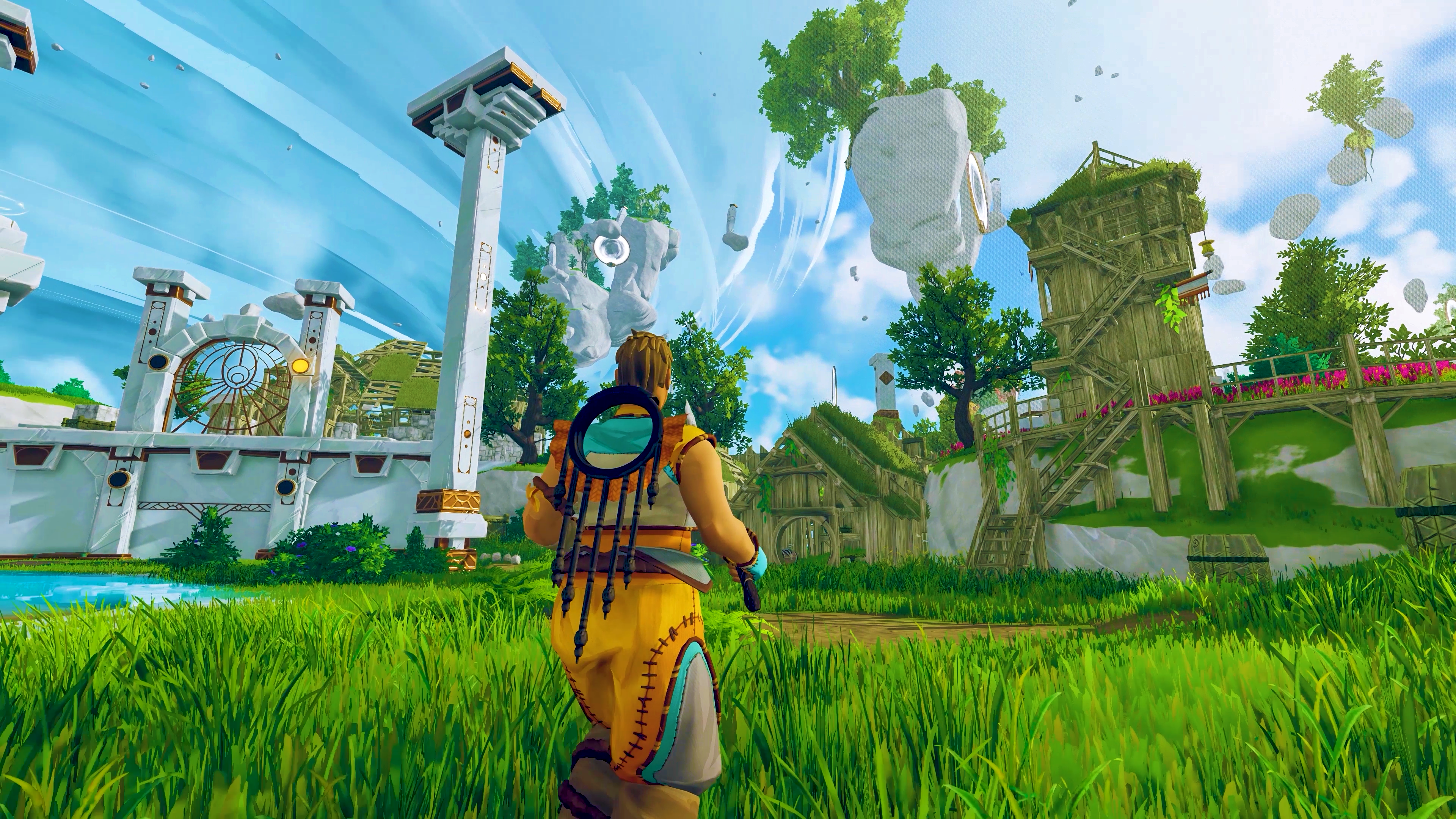 A character faces ruined stone columns, wooden buildings and floating rocks beneath a blue sky.