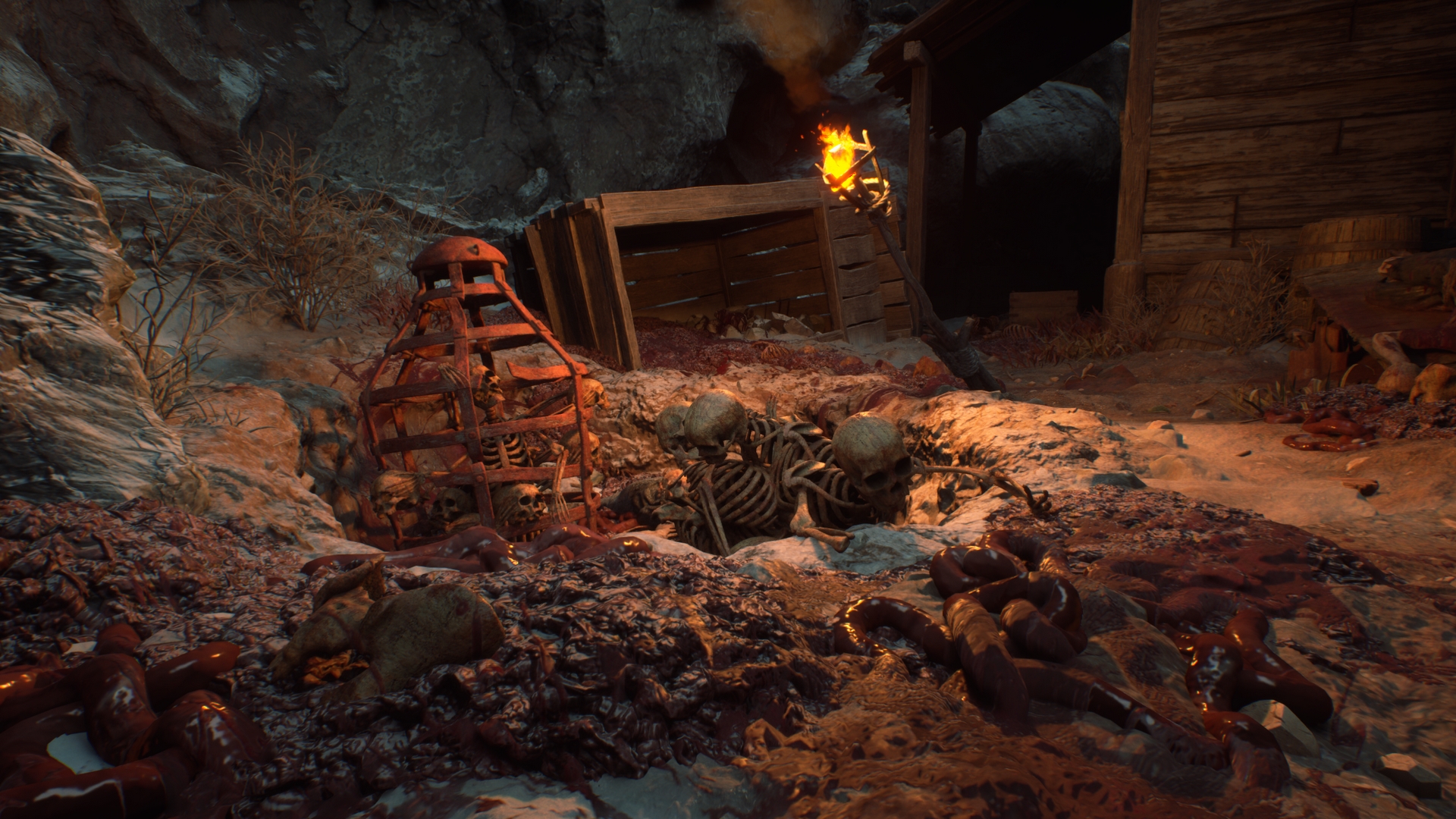 Torchlight illuminates skeletal remains beside a wooden mine entrance in Stygian: Outer Gods.