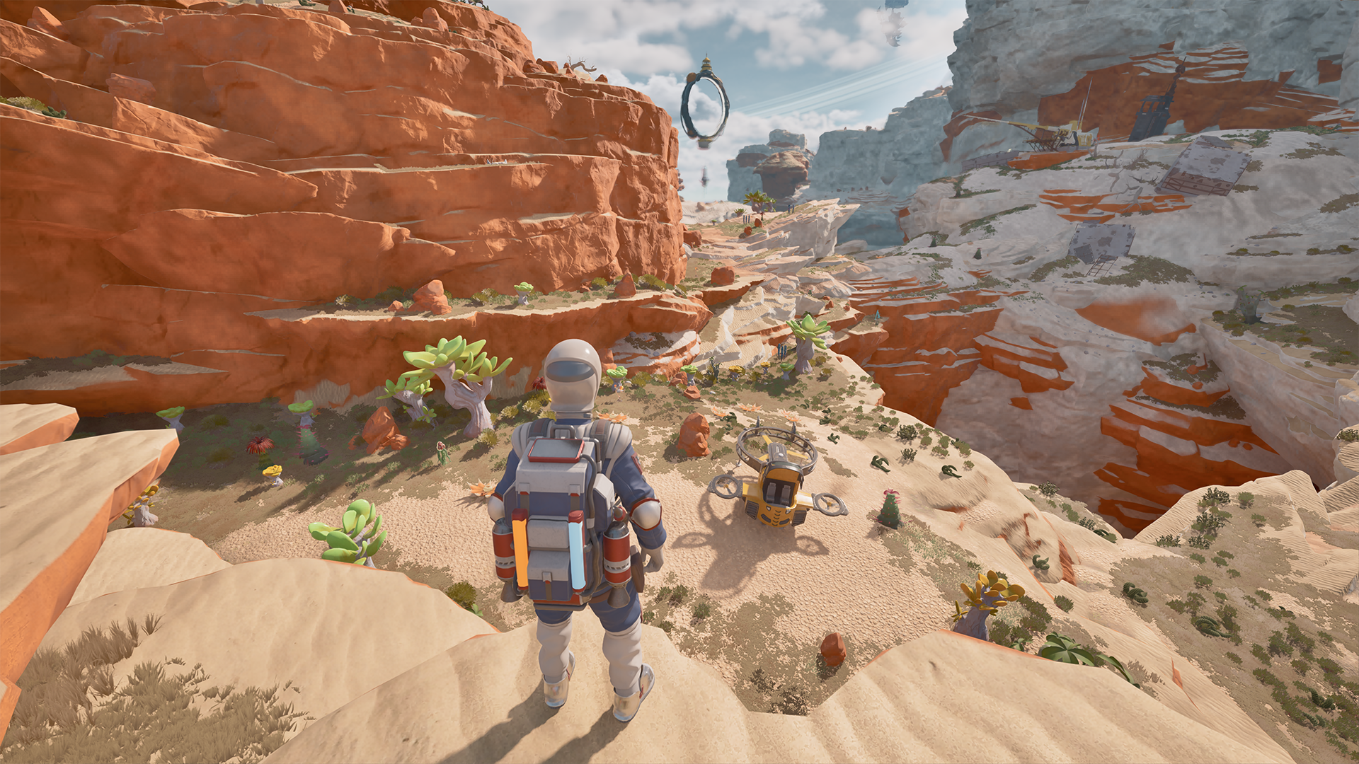 A suited character overlooks a small yellow craft in an orange canyon.