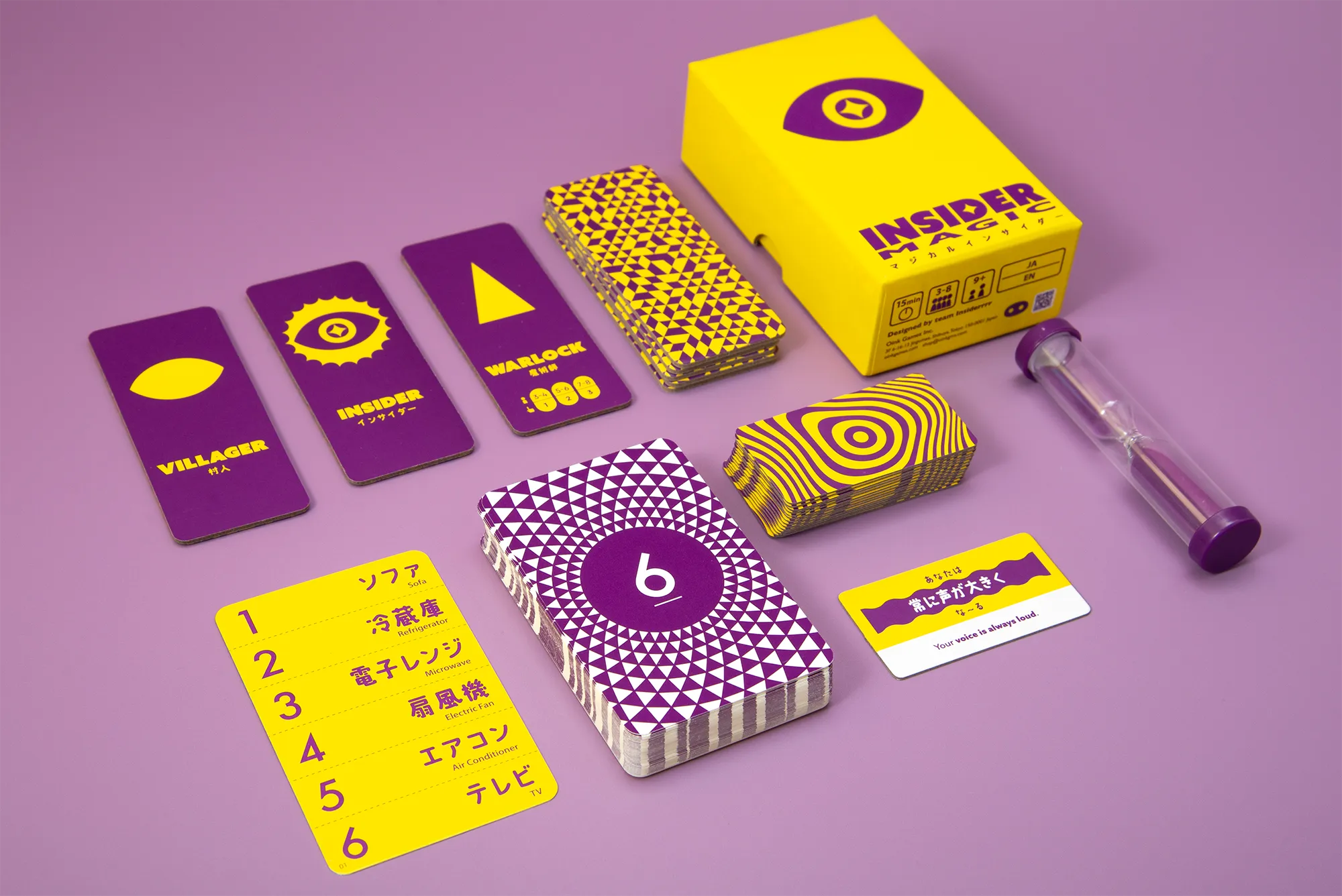 Insider Magic box, role cards, topic deck and timer arranged on a pink table.