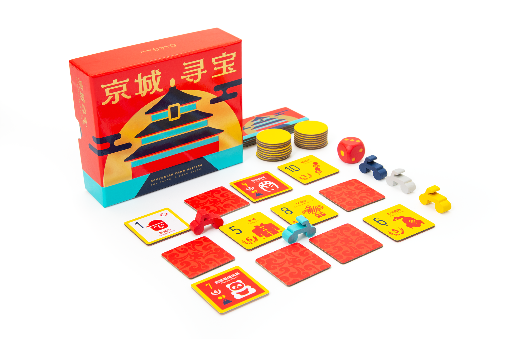 Souvenirs from Beijing red box, souvenir tiles, bicycle pieces, coins and a die.