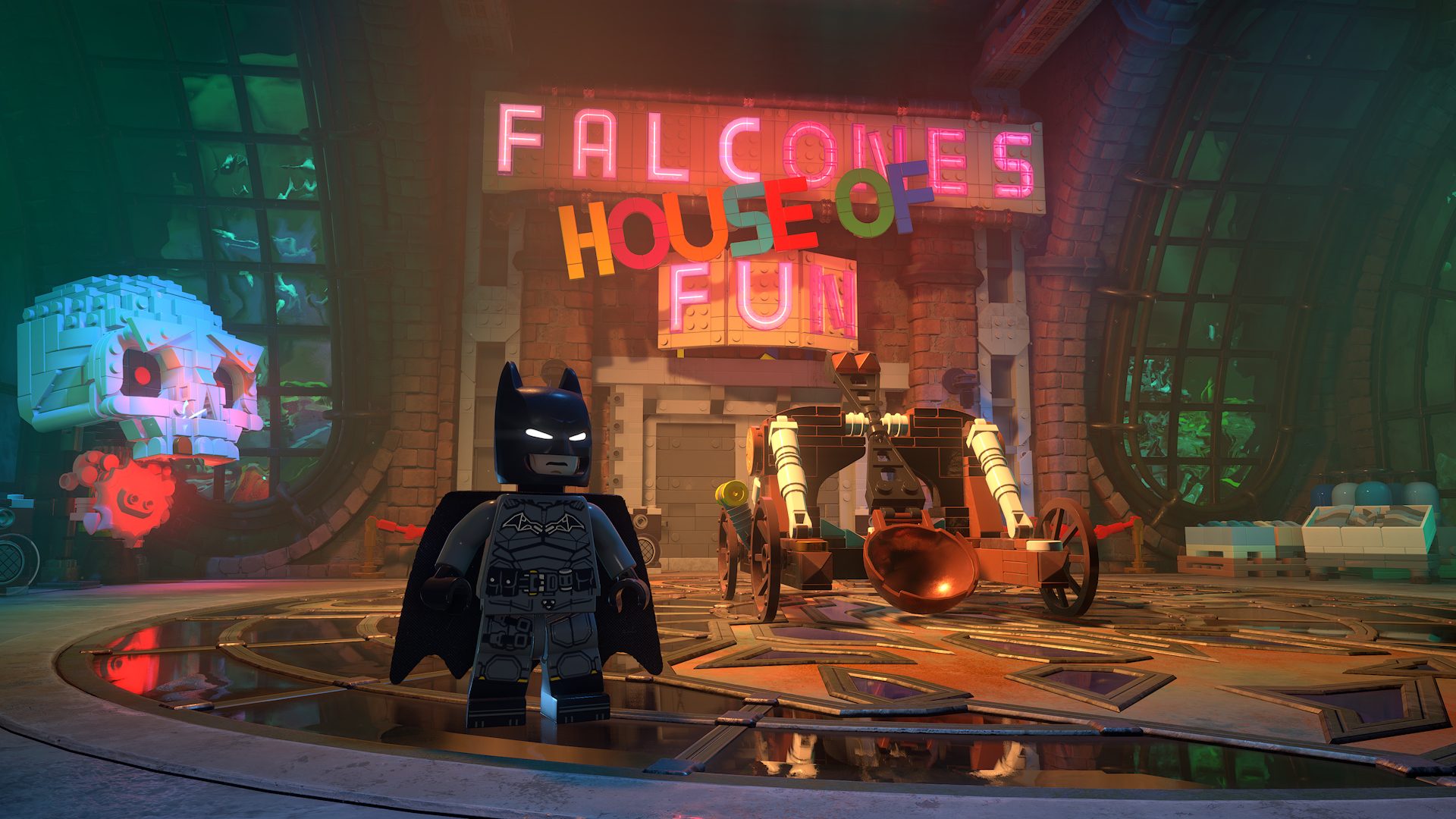 Official LEGO Batman gameplay screenshot from PlayStation Blog showing Batman inside Falcone's House of Fun during the hands-on preview.