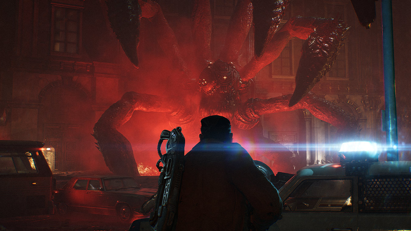 Official Gears of War: E-Day screenshot showing a squad fighting through a dark combat space with gunfire and heavy effects.
