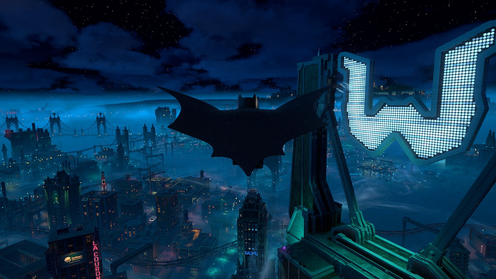 Official LEGO Batman screenshot from PlayStation Blog showing Batman gliding above Gotham City at night during the hands-on preview.