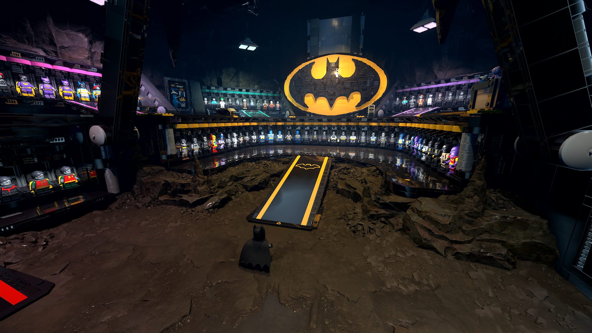 Official LEGO Batman screenshot from PlayStation showing another Batcave view tied to customization and progression systems.