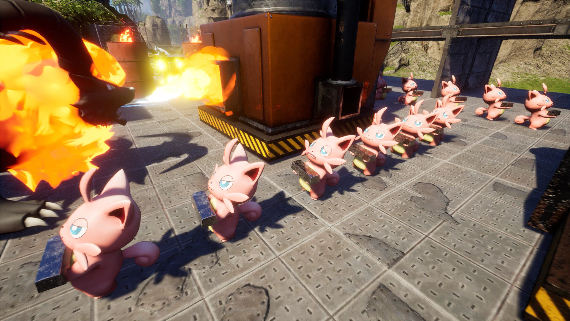 Official Palworld screenshot showing multiple small pink Pals carrying materials around a busy industrial base while a larger Pal breathes fire nearby.