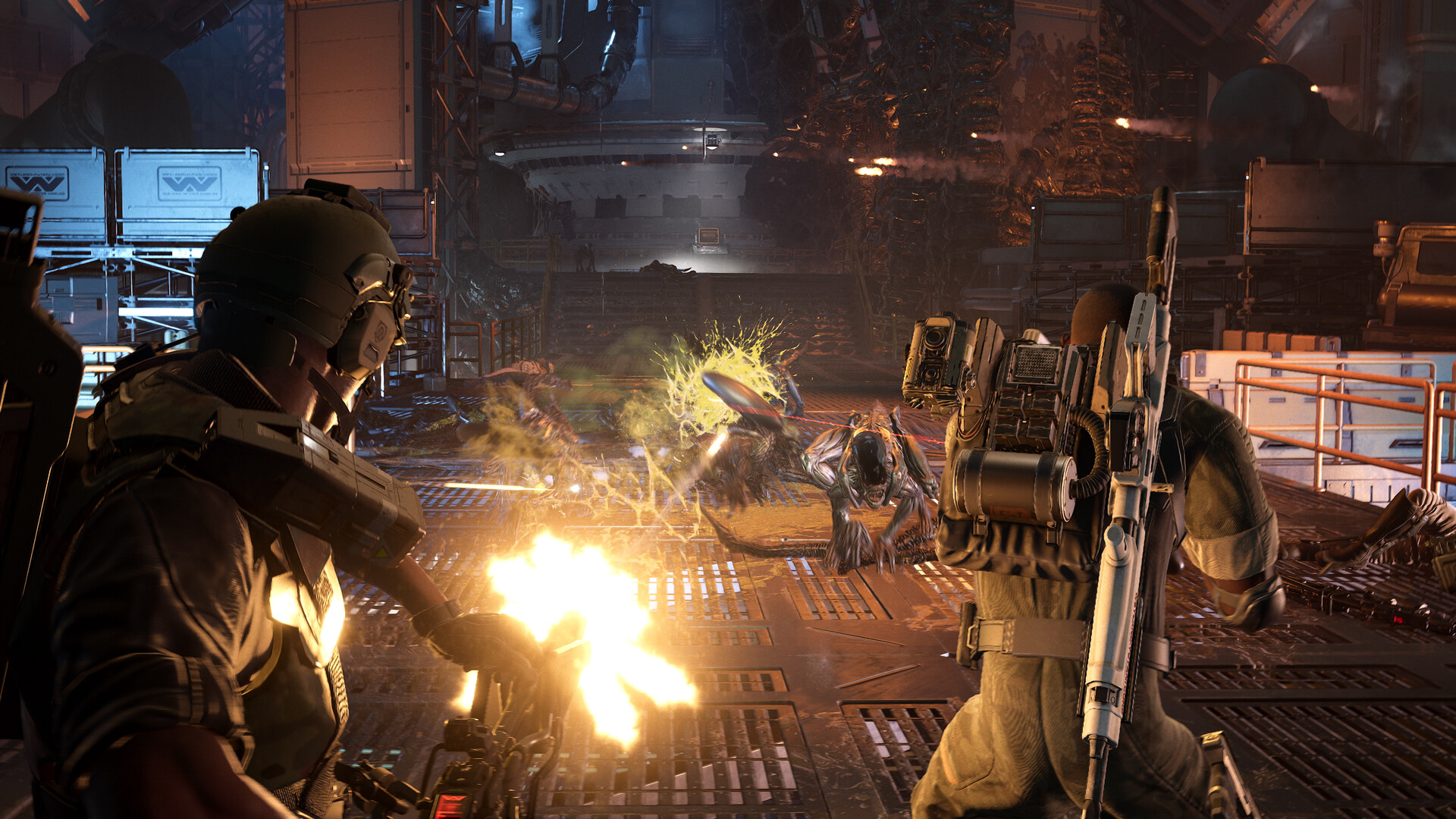 Official Aliens: Fireteam Elite 2 Steam screenshot showing Colonial Marines fighting xenomorphs in an industrial combat arena.