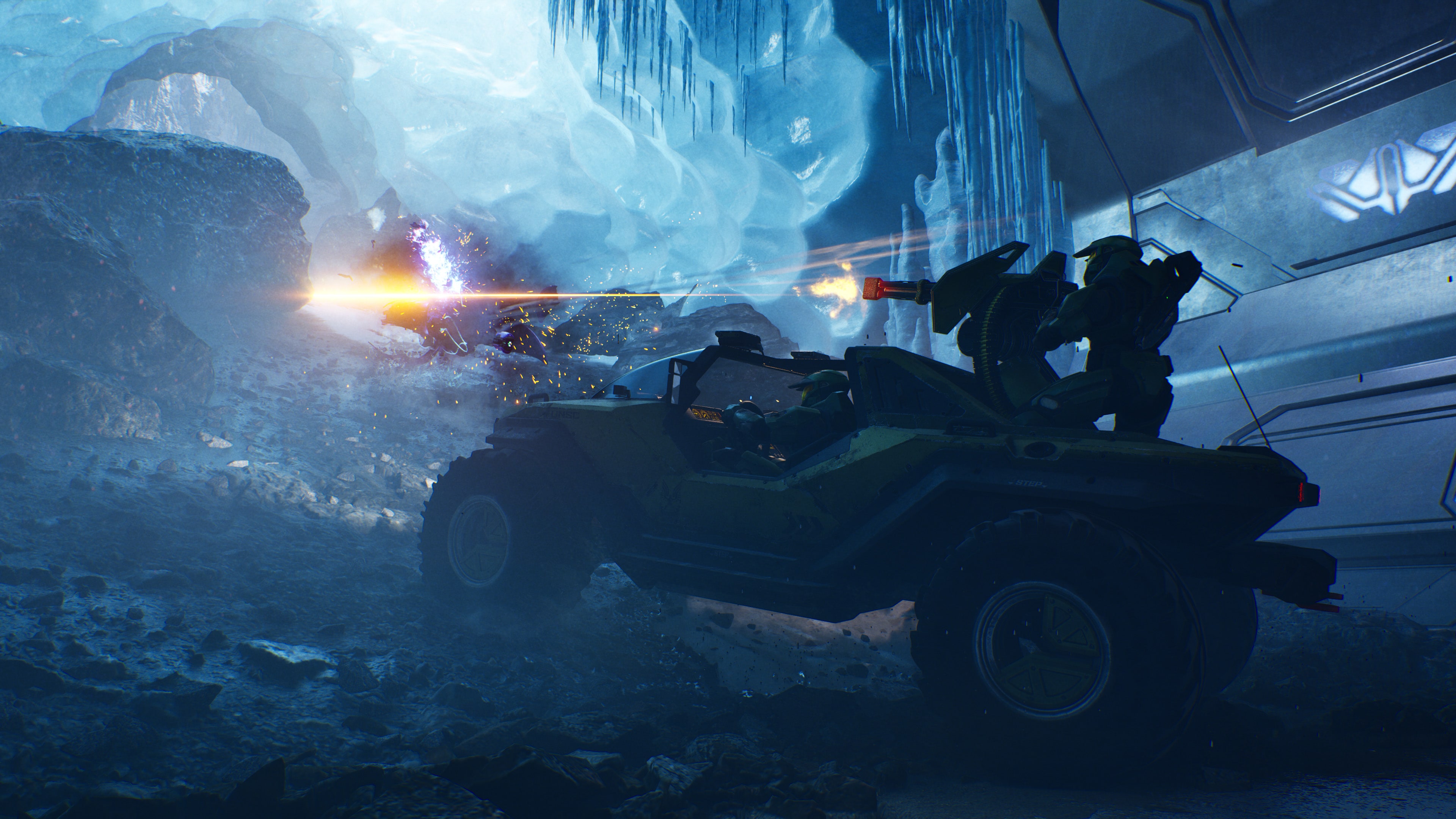 Official Halo: Campaign Evolved screenshot showing a Warthog combat sequence inside an icy Forerunner area.