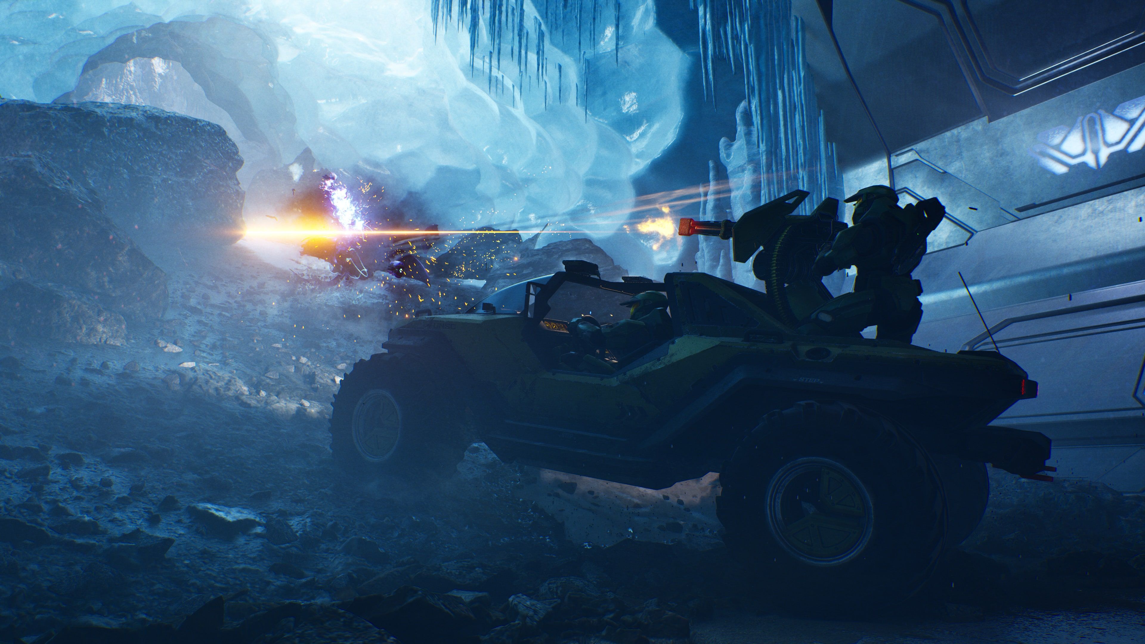 Official Halo: Campaign Evolved screenshot showing a Warthog combat sequence inside an icy Forerunner area.