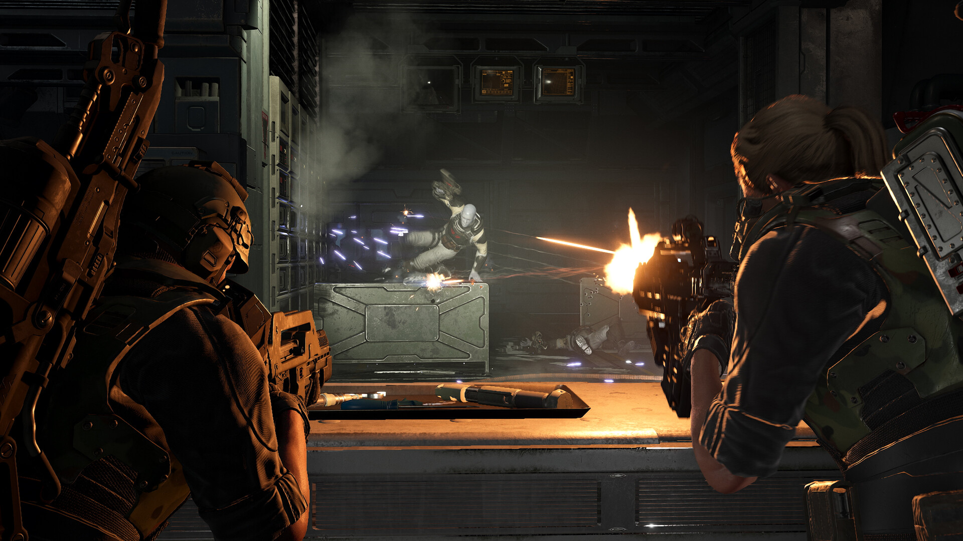 Official Aliens: Fireteam Elite 2 Steam screenshot showing a marine squad facing a xenomorph rush in a dark corridor.