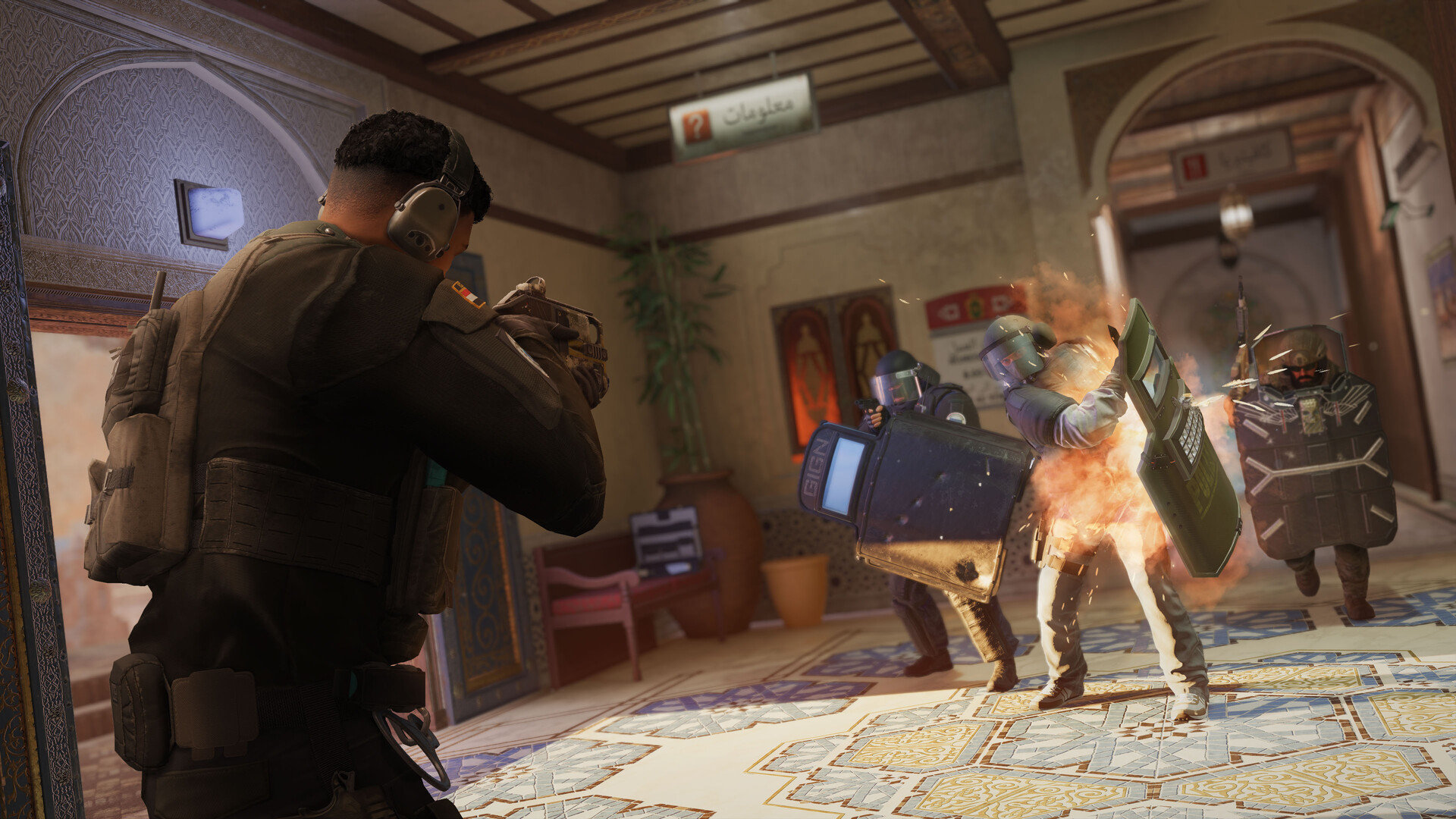 Official Rainbow Six Siege screenshot from Steam showing a defender aiming down sights during an interior firefight.
